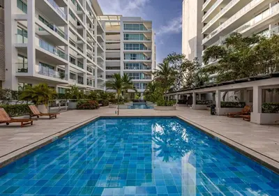 a large swimming pool in front of a building at Apartamento Morros 3 Cartagena, Piscina Playa y Mar in Cartagena de Indias