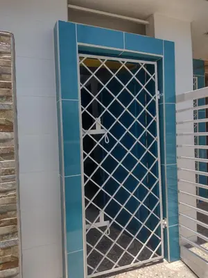 a glass door with shoes inside of it at Casa Angie in Cartagena de Indias