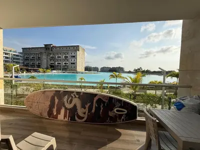 a large tub in a room with a view of the ocean at Vista a Laguna cristalina + 2 alc + parking in Cartagena de Indias
