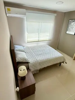 a small bedroom with a bed and a window at Apto Moderno Cómodo y acogedor Excelente ubicación Norte Barranquilla in Barranquilla