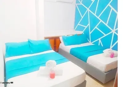 a room with two beds with blue and white at apto cartagena con vista al mar 11 in Cartagena de Indias