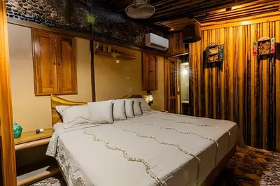 a bedroom with a large bed in a room at Tita Tati Disconnect near Cartagena in Punta Canoas