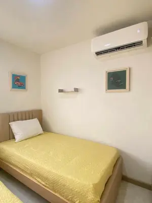 a bedroom with a bed and a air conditioner on the wall at Cartagena Chic Full Apto in Cartagena de Indias