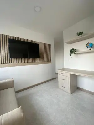 a living room with a flat screen tv on a wall at Cartagena Chic Full Apto in Cartagena de Indias