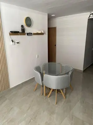 a dining room with a glass table and chairs at Sky View Apartment en Barranquilla in Barranquilla