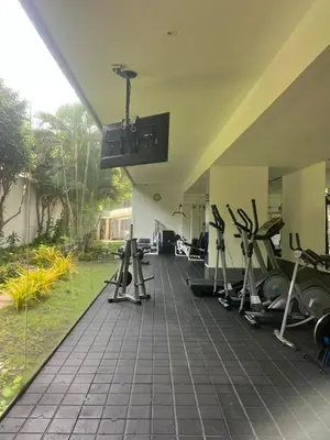 a gym with exercise equipment and a large window at Morros Vitri directo al Mar in Cartagena de Indias
