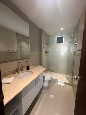 a bathroom with a toilet and a sink and a shower at Morros Vitri directo al Mar in Cartagena de Indias
