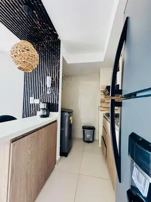 a kitchen with a sink and a refrigerator at Villas del mar in Cartagena de Indias