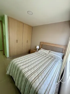 a bedroom with a large bed in a room at Apto Acogedor Moderno y Familiar Excelente Ubicación norte Barranquilla in Barranquilla
