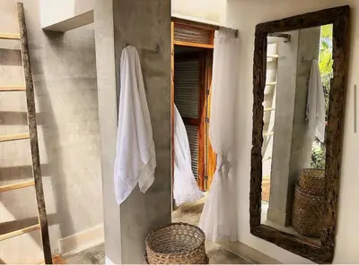 a mirror hanging on a wall next to a doorway at En La Casa Del Mar in Moñitos