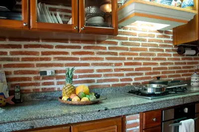 a bowl of fruit on a counter in a kitchen at Luxury Colonial Villa Old City Cartagena Rooftop Views Private Pool in Cartagena de Indias