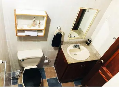 a bathroom with a sink and a toilet and a mirror at Confort Compartida Ctg x3 in Cartagena de Indias