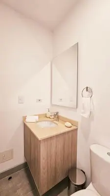 a bathroom with a sink and a mirror at 1BD Luxe Shore & Balcony Sunrise Next to the Beach in Santa Marta