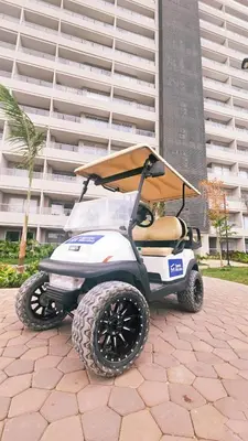 a golf cart parked in front of a building at Caribbean Retreat Direct Beach Access in Santa Marta