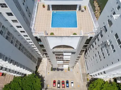 an overhead view of a swimming pool between two cruise ships at Vita 902 Paraíso Costero in Cartagena de Indias