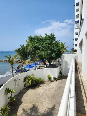 a walkway to the beach from the balcony of a building at Vita 902 Paraíso Costero in Cartagena de Indias