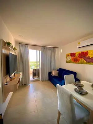 a living room with a blue couch and a table at Anny Luxury Apartment - Santa Marina in Santa Marta