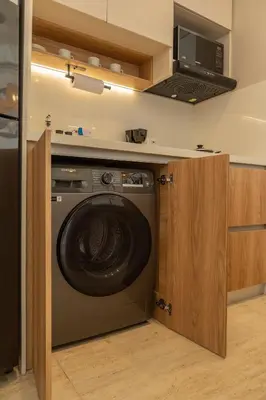 a washing machine in a kitchen with a microwave at CB1515 | Lujosa suite con vista al mar y balcón in Cartagena de Indias