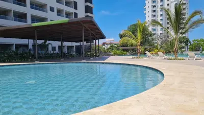 a swimming pool in the middle of a building at Living Sunset by Santa Marina in Santa Marta