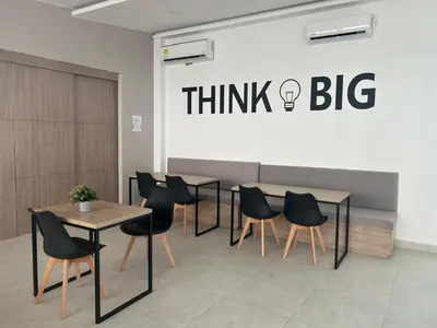 a restaurant with tables and chairs and a think big sign at Cartagena 2 Hab con Terraza Privada Playa 12 min Parking in Manzanillo del Mar