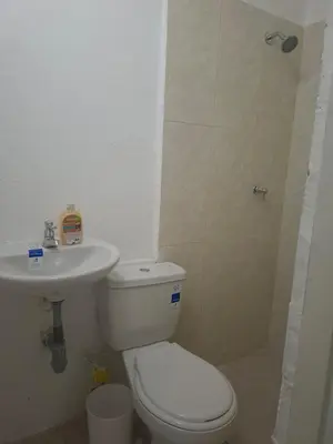 a bathroom with a toilet and a sink at Alojamiento Marbella Turismo in Cartagena de Indias