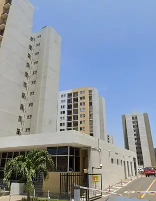 a building with two tall buildings in a city at Apartamento en Barranquilla Alameda del Rio in Barranquilla