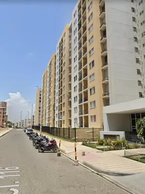 a row of motorcycles parked next to tall buildings at Apartamento en Barranquilla Alameda del Rio in Barranquilla