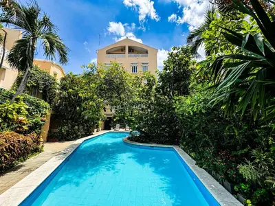 a swimming pool in front of a building at Bohemia home Getsemaní in Cartagena de Indias