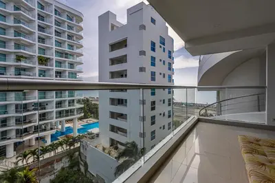 an apartment balcony with a view of a building at Morros Malibu Beach - Con vista al mar in Cartagena de Indias