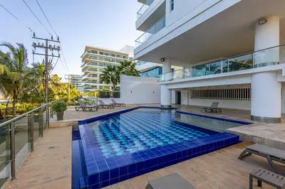 a swimming pool in the middle of a building at Morros Malibu Beach - Con vista al mar in Cartagena de Indias