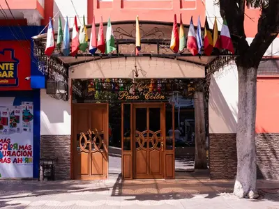 a group of flags hanging over the doors of a restaurant at Hotel Paseo Colon in Barranquilla
