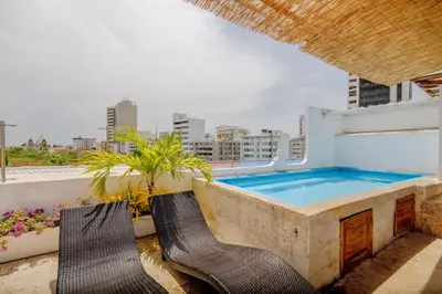 a swimming pool on the roof of a building at La Dominica Hotel Boutique in Cartagena de Indias