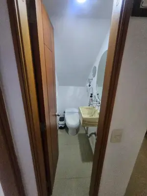 a small bathroom with a toilet and a sink at Guest House with AC, close to Historical Centre 1 in Cartagena de Indias