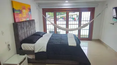 a bedroom with a bed in a room with a window at Guest House with AC, close to Historical Centre 1 in Cartagena de Indias