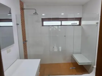 a white bathroom with a shower and a sink at Guest house with AC close to Historical Centre 2 in Cartagena de Indias