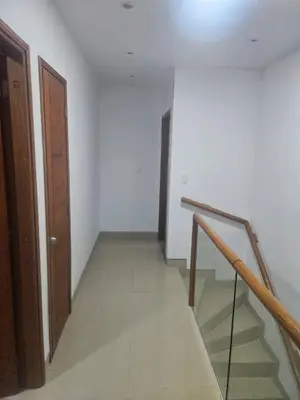 an empty hallway with a staircase and a door at Guest house with AC close to Historical Centre 2 in Cartagena de Indias