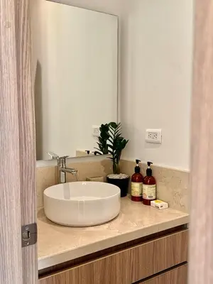 a bathroom with a sink and a mirror at Luxury Apartment betwen Cartagena and Barranquilla in Juan de Acosta