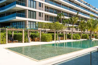 a swimming pool in front of a building at Deluxe en MorrosEos con piscina privada y salida a la playa in Cartagena de Indias