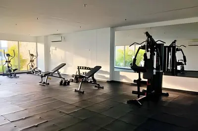a gym with several treadmills and exercise bikes at Baia Kristal: descanso, vista y naturaleza única in Los Arrayanes