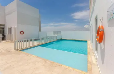a swimming pool on the side of a building at Apartamento Cerca al Mar Cartagena in Cartagena de Indias