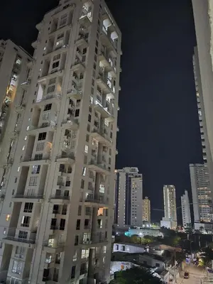a tall building in a city at night at Apartamento Cerca al Mar Cartagena in Cartagena de Indias
