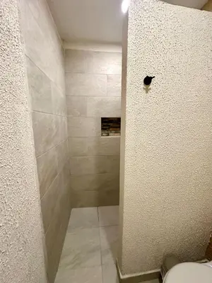 a bathroom with a shower with a toilet at Casa Salvatore - Getsemani - Private pool in Cartagena de Indias