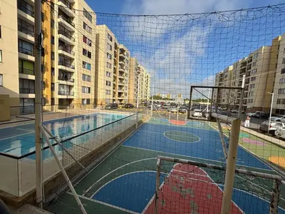 a basketball court with a net in a city at Corazón de quilla in Barranquilla