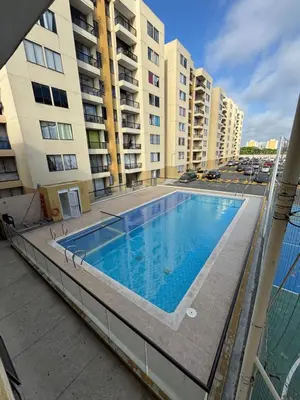 a swimming pool on the balcony of a apartment building at Corazón de quilla in Barranquilla