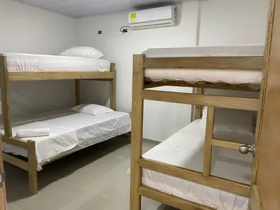 a room with three bunk beds in a room at MiraMar in Guayabal