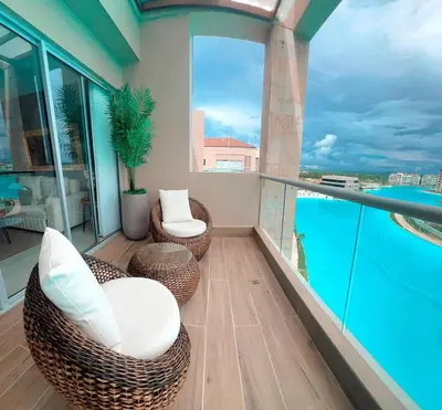 a balcony with chairs and a view of the water at Baia Kristal Top Floor-Elegance and Luxury View in Los Arrayanes
