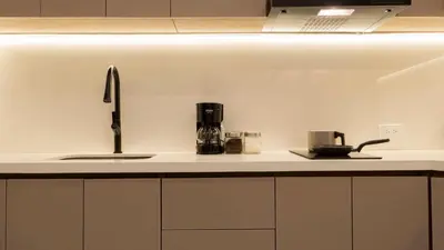 a kitchen counter with a sink and a coffee maker at Maravillosa suite frente al mar y atardecer CB911 in Cartagena de Indias
