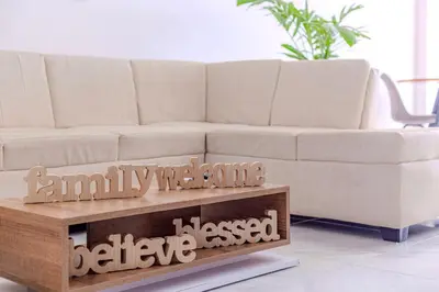 a white couch in a living room with a coffee table at Spacious beachfront apartment in Cartagena de Indias