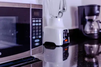 a microwave sitting on top of a counter at Spacious beachfront apartment in Cartagena de Indias