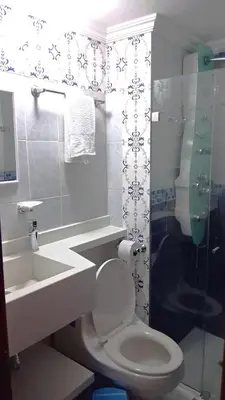 a bathroom with a toilet and a sink at apartamento en marbella dúplex, cerca centro histórico - 3 in Cartagena de Indias
